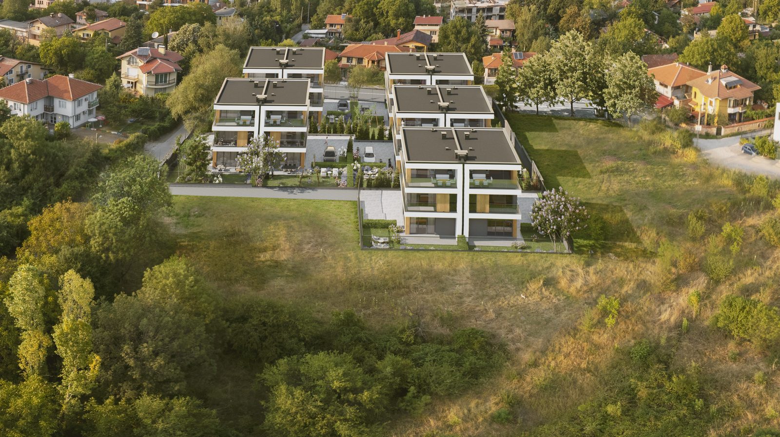 Къщите на SIENA home от птичи поглед — сградите, дворовете и зеленината около тях
